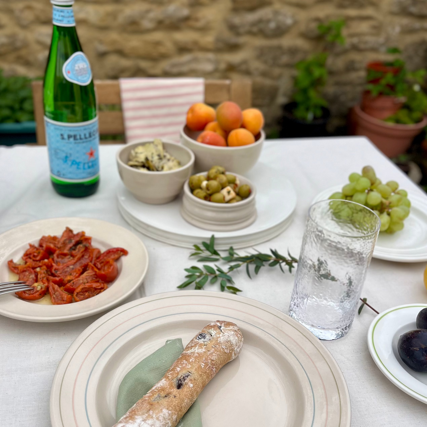 Summer Table laid with a mix of Stoneware and Porcelain Tableware