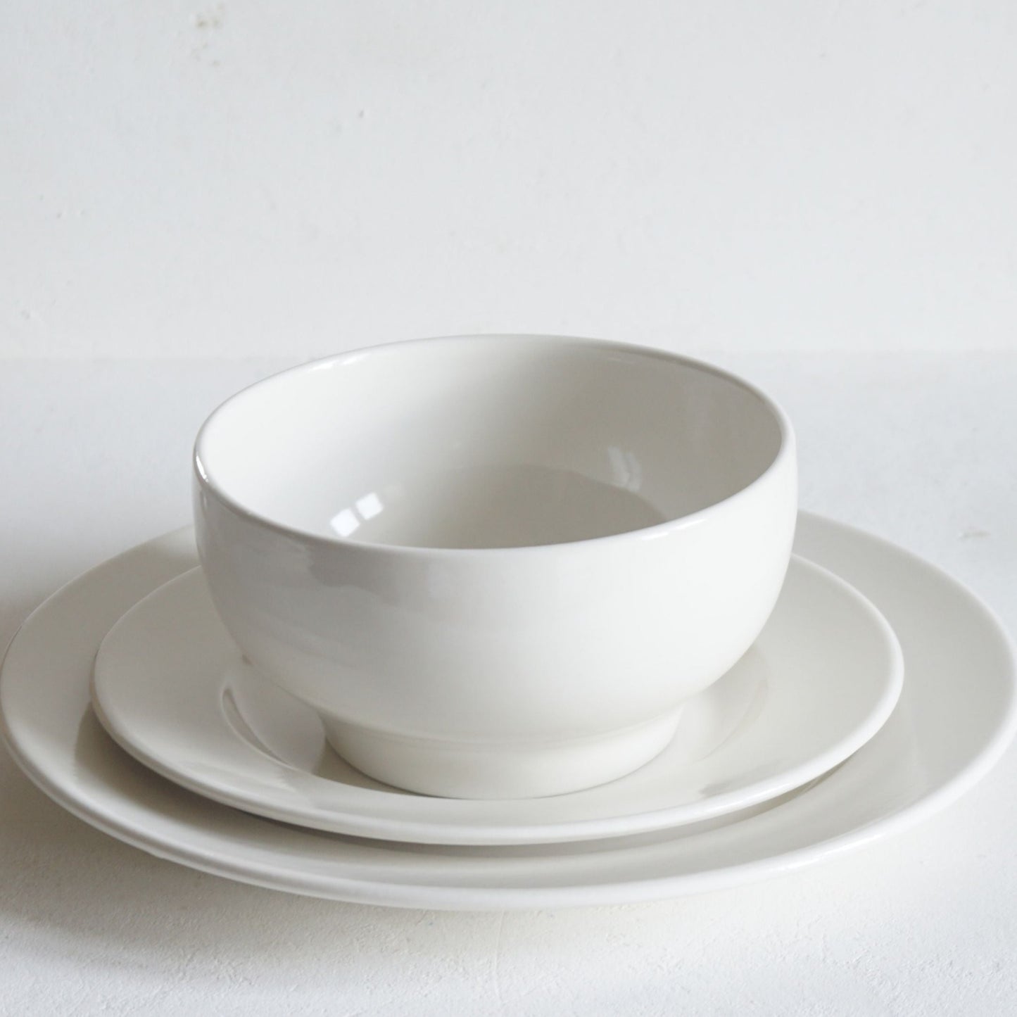 Three piece dinnerware set including Plain Porcelain Side Plate, Dinner Plate and Simple Bowl