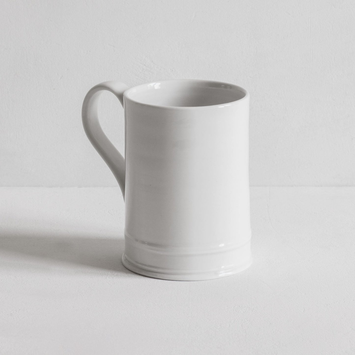 Classical hand thrown mug in porcelain