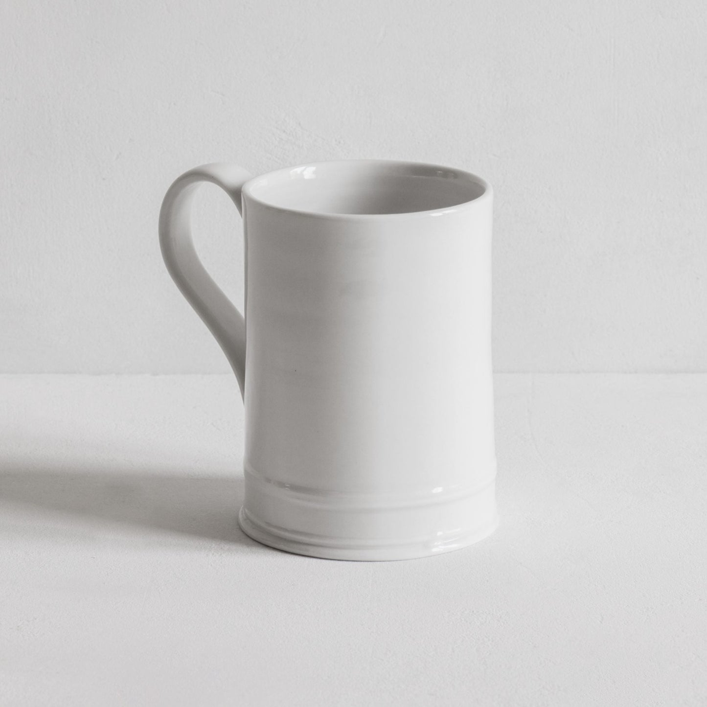 Classical hand thrown mug in porcelain